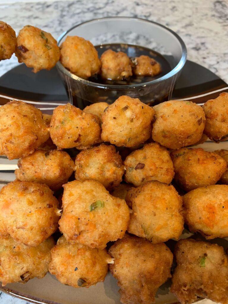 8 Easy Steps to Make the Best Tilapia Fish Ball Recipe at Home Tilapia fish ball recipe photo featuring golden, crispy homemade fish balls served with a savory dipping sauce. A close-up view highlights the texture, vegetables, and perfectly fried finish of this Filipino-style snack.