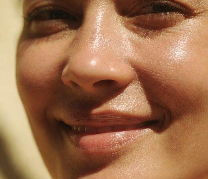 High-quality close-up photo of smiling Filipino cheeks showing a natural healthy glow for "Cheeks in Tagalog" guide.