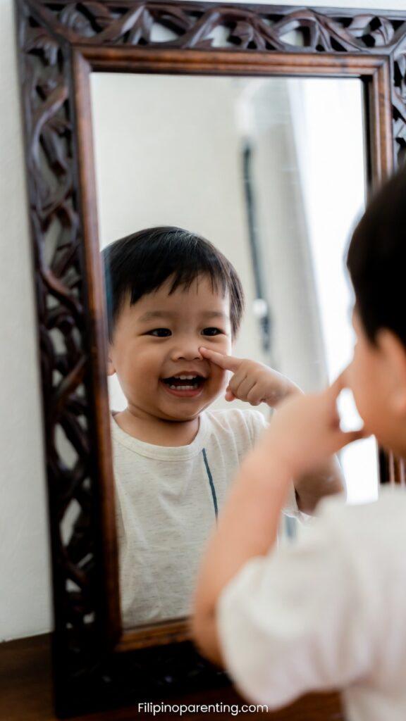 55 Fascinating Body Parts in Tagalog: The Ultimate Guide Child Pointing to Face - Body Parts in Tagalog Practice