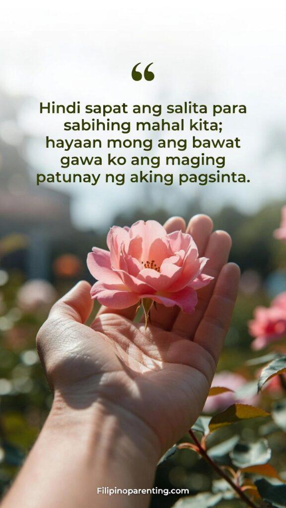 Deep Tagalog Love Quotes for a Gentle Heart: 5 Enchanting Expressions Vertical soft-focus image of a hand gently holding a blossoming flower, symbolizing tenderness and proof of affection, featuring the Tagalog quote about actions vs. words.