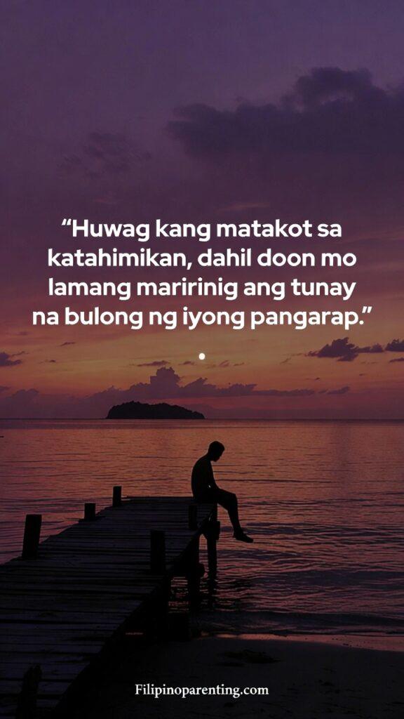Filipino Quotes for Self-Discovery and Growth: 5 Unstoppable Truths A silhouette of a person by the sea at sunset with a Tagalog quote about silence and dreams.