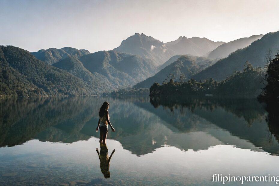 A reflection in a mountain lake representing Filipino Quotes for Self-Discovery and Growth.
