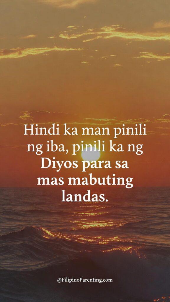 Tagalog Quotes for Broken Hearted: 12 Powerful Lines for Healing A vertical image of a golden sunset over the ocean with rippling waves. Centered white text in Tagalog says, "Hindi ka man pinili ng iba, pinili ka ng Diyos para sa mas mabuting landas," which translates to being chosen by God for a better path.