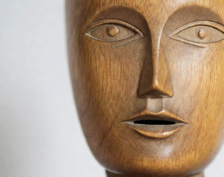 A close up of a wooden model showing the mouth in Tagalog