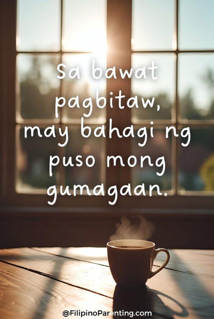Tagalog Quotes for Broken Hearted: 12 Powerful Lines for Healing A steaming cup of coffee on a wooden table in front of a window with bright sunlight. The Tagalog quote reads, "Sa bawat pagbitaw, may bahagi ng puso mong gumagaan."