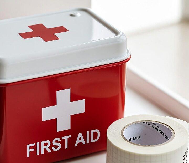 A first aid kit and bandage representing Tagalog Medical Emergency Words