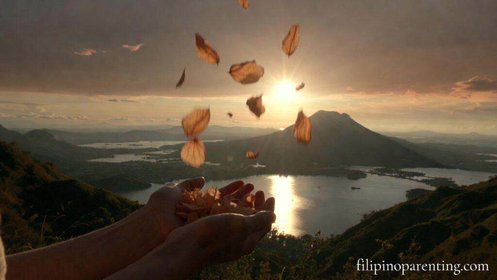 Tagalog Quotes About Letting Go and Moving On: 5 Unforgettable Reflections Hands releasing flower petals at sunset representing Tagalog Quotes About Letting Go and Moving On.