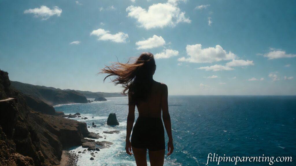 Tagalog Quotes Maniwala Ka Confidence Courage: 5 Unstoppable Truths A woman standing on a cliff in Batanes representing Tagalog Quotes Maniwala Ka Confidence Courage.