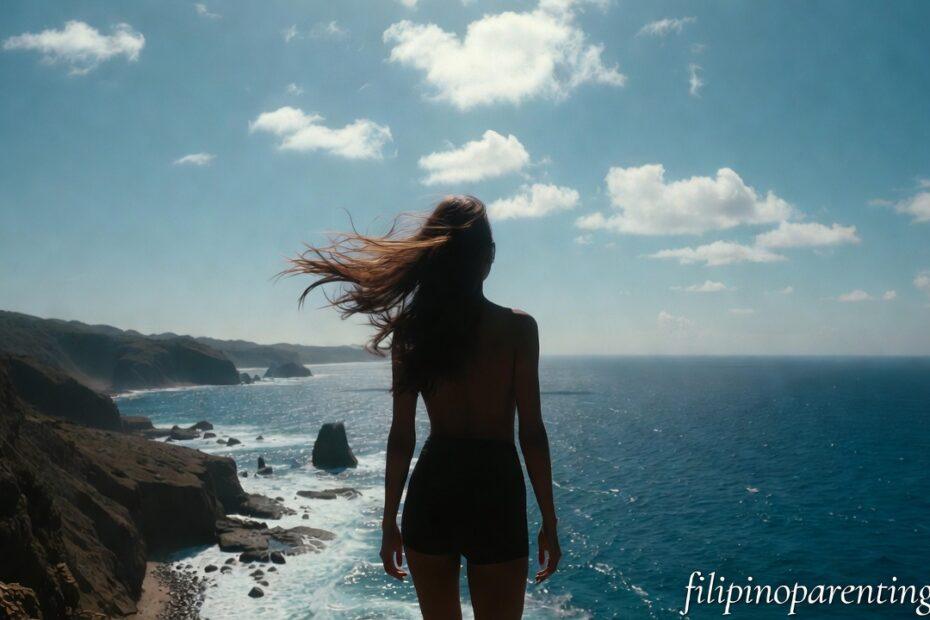 A woman standing on a cliff in Batanes representing Tagalog Quotes Maniwala Ka Confidence Courage.