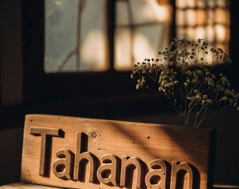 A "Tahanan" wooden sign in a sunlit Filipino home representing Tagalog Quotes Tahanan ng Puso Family Love Strength.