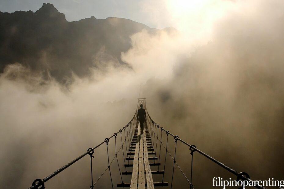 A person on a bridge in the mist representing Tagalog Quotes Walking by Faith Not by Sight.
