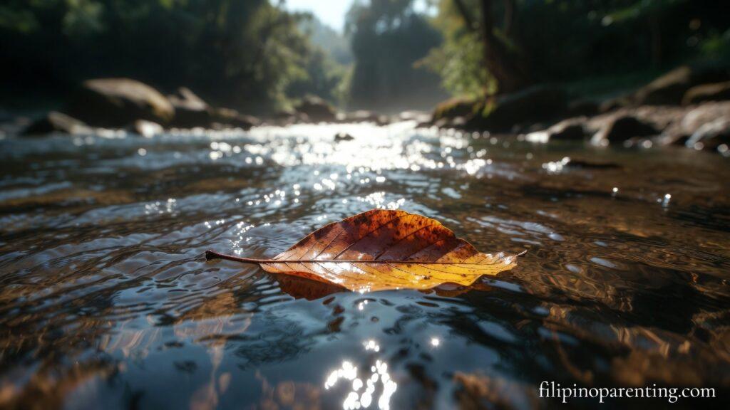 Tagalog Quotes on Moving On and Pagbitaw: 5 Empowering Lessons A leaf floating on a stream representing Tagalog Quotes on Moving On and Pagbitaw.