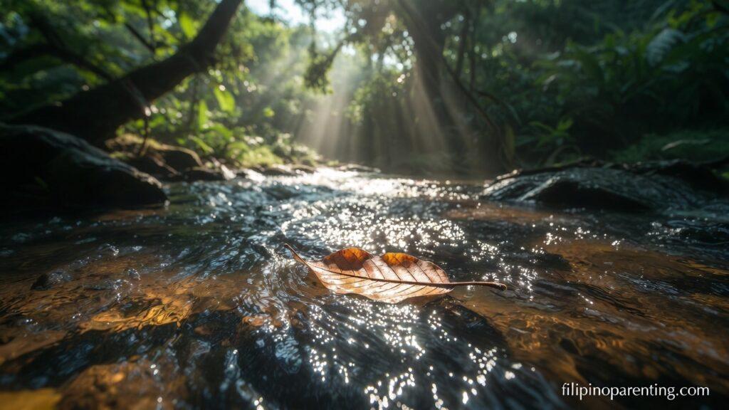 Tagalog Sayings Surrender Divine Will Peace: 5 Sacred Truths A leaf floating on a stream representing Tagalog Sayings Surrender Divine Will Peace.