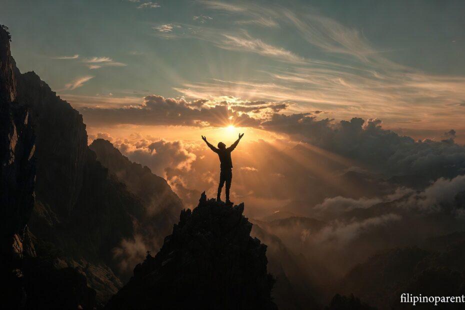 A silhouette on a mountain at sunrise representing Tagalog Sayings on God’s Victory and Rising Faith.