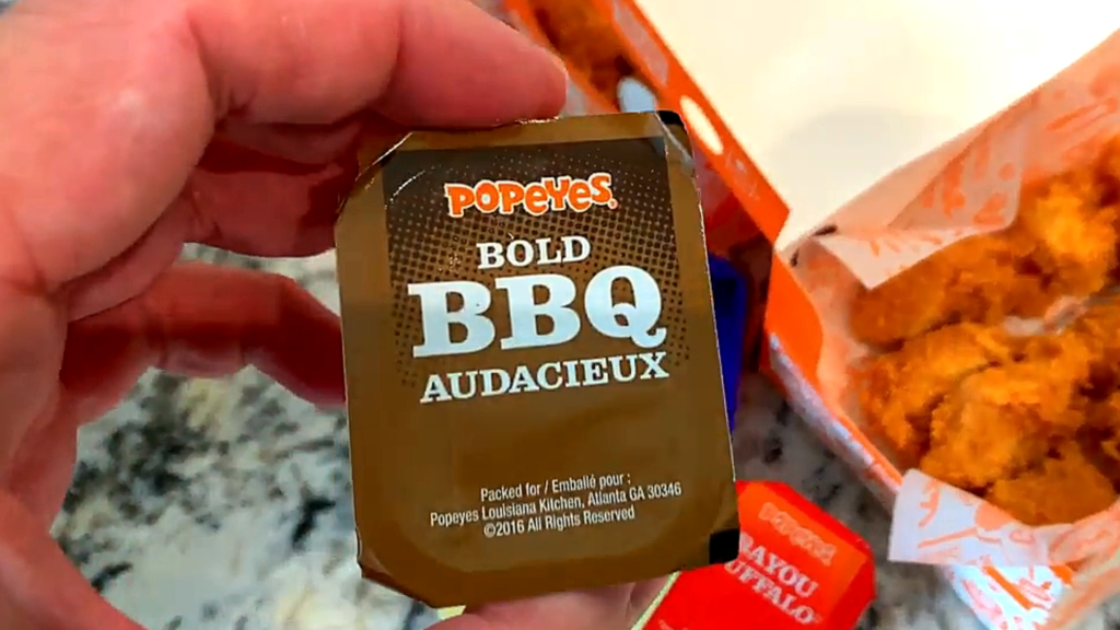 Popeyes Chicken Tenders Pembroke Ontario: 5 Reasons We Often Enjoy This Popular Ontario Fast Food in the GTA Popeyes Bold BBQ (Audacieux) dipping sauce with a box of chicken tenders in Pembroke, Ontario.